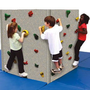 three kids happily using the Tyke Tower Climbing Wall