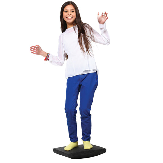 Girl standing on the Foam Rocker Board
