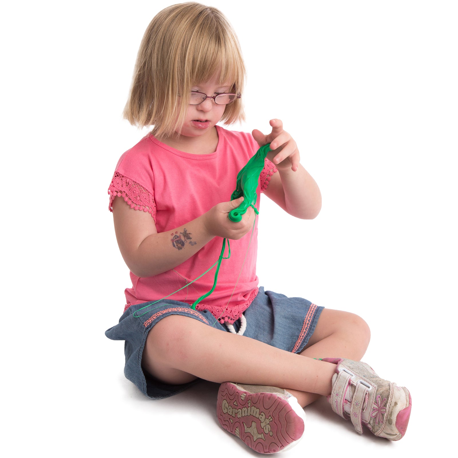 Girl playing with the Regulation Putty