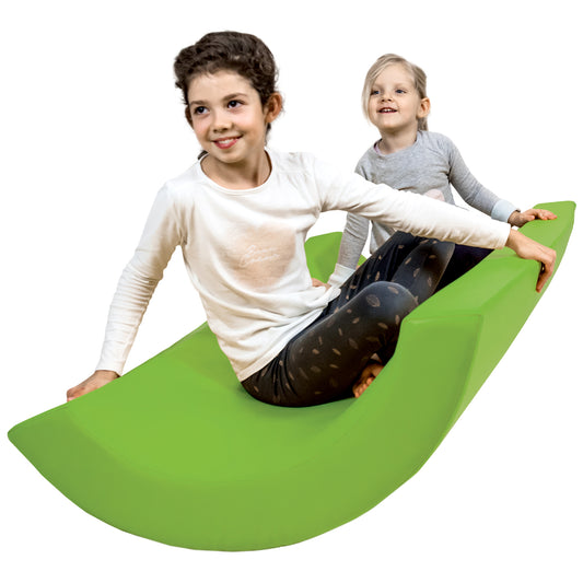 Two girls smiling while using the SensaSoft™ Rocking Half Barrel