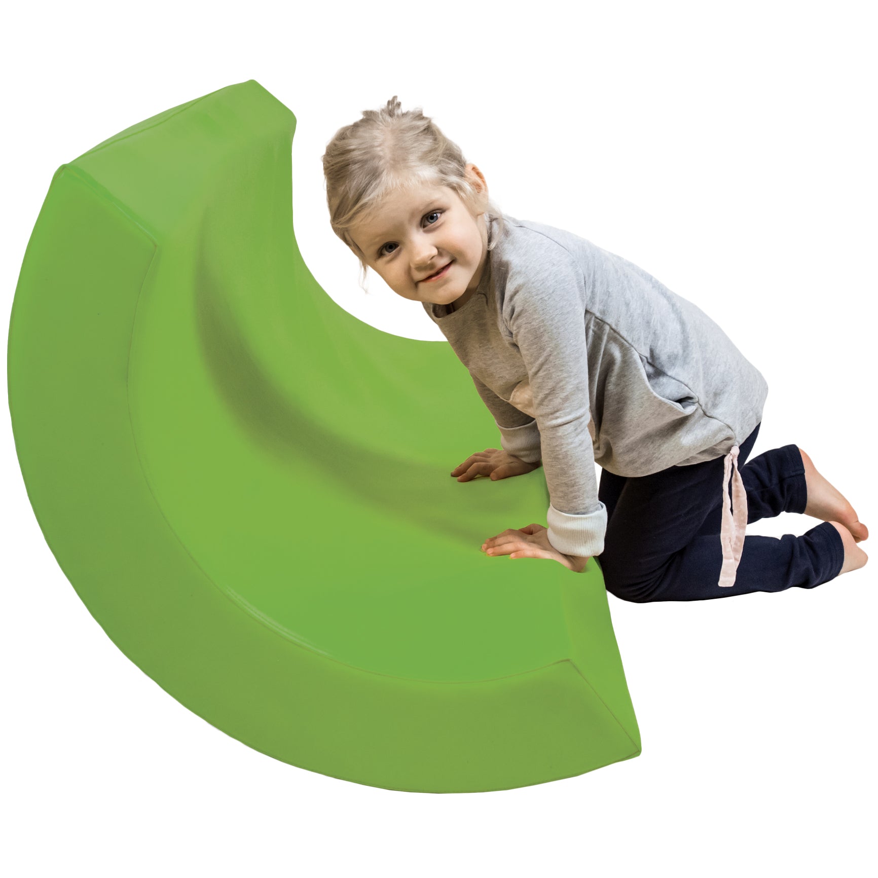 Child smiling while using the green SensaSoft™ Rocking Half Barrel