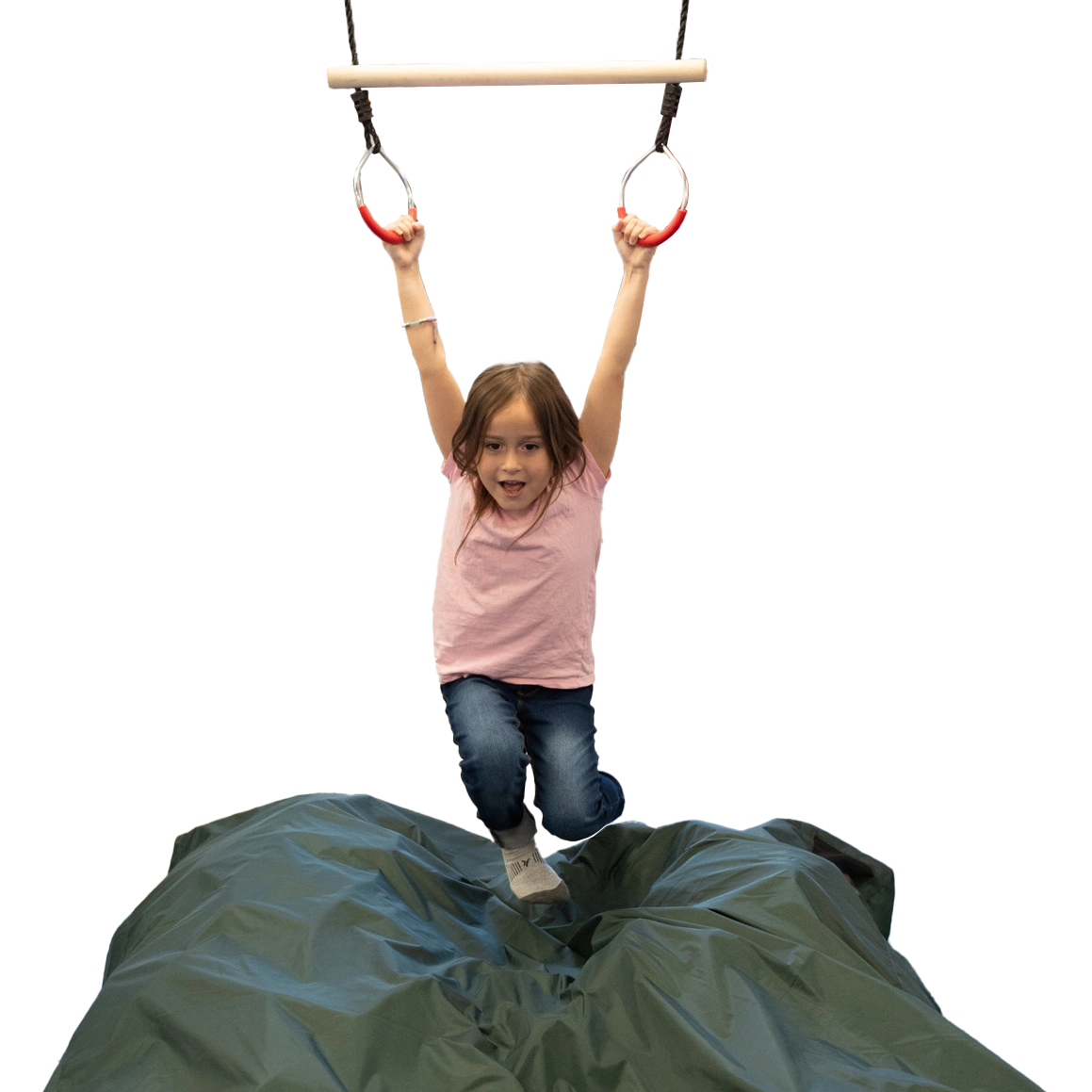 girl swinging and hanging from Trapeze Swing above crash mat