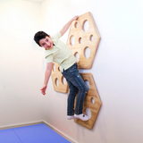 Child climbing on the Honeycomb Climbing Panels - Set of 3