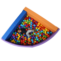 Top view of child laying in the SensaSoft™ Foldable Ball Pit - Corner