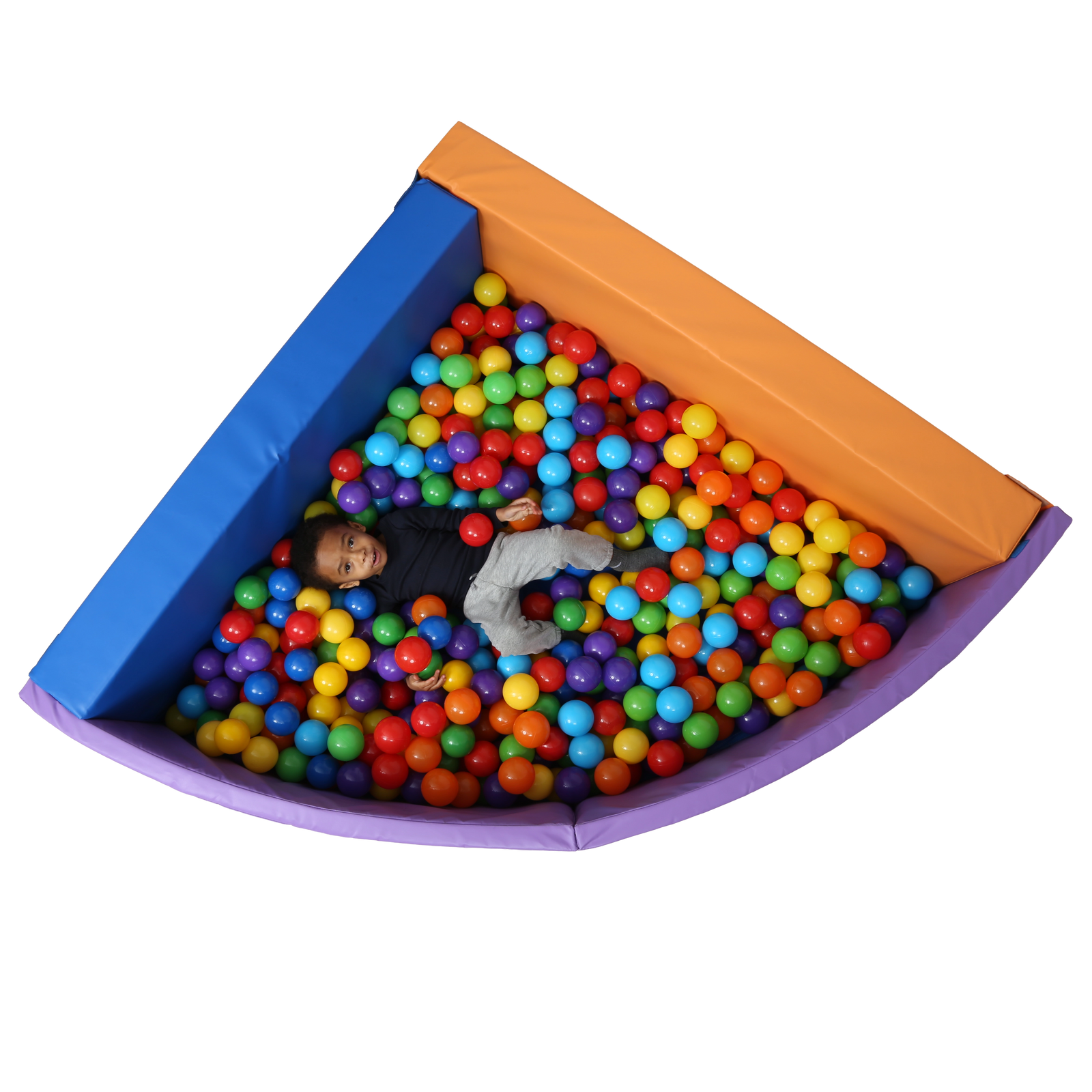 Top view of child laying in the SensaSoft™ Foldable Ball Pit - Corner