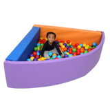 Child sitting inside the SensaSoft™ Foldable Ball Pit - Corner