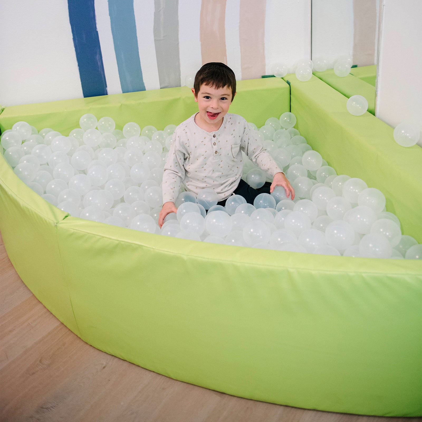 Child playing in the SensaSoft™ Foldable Ball Pit - Corner