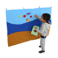 Child putting items on the Felt Storyboard