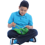 Boy playing with the Busy Fingers™ Fidget Lap Pad