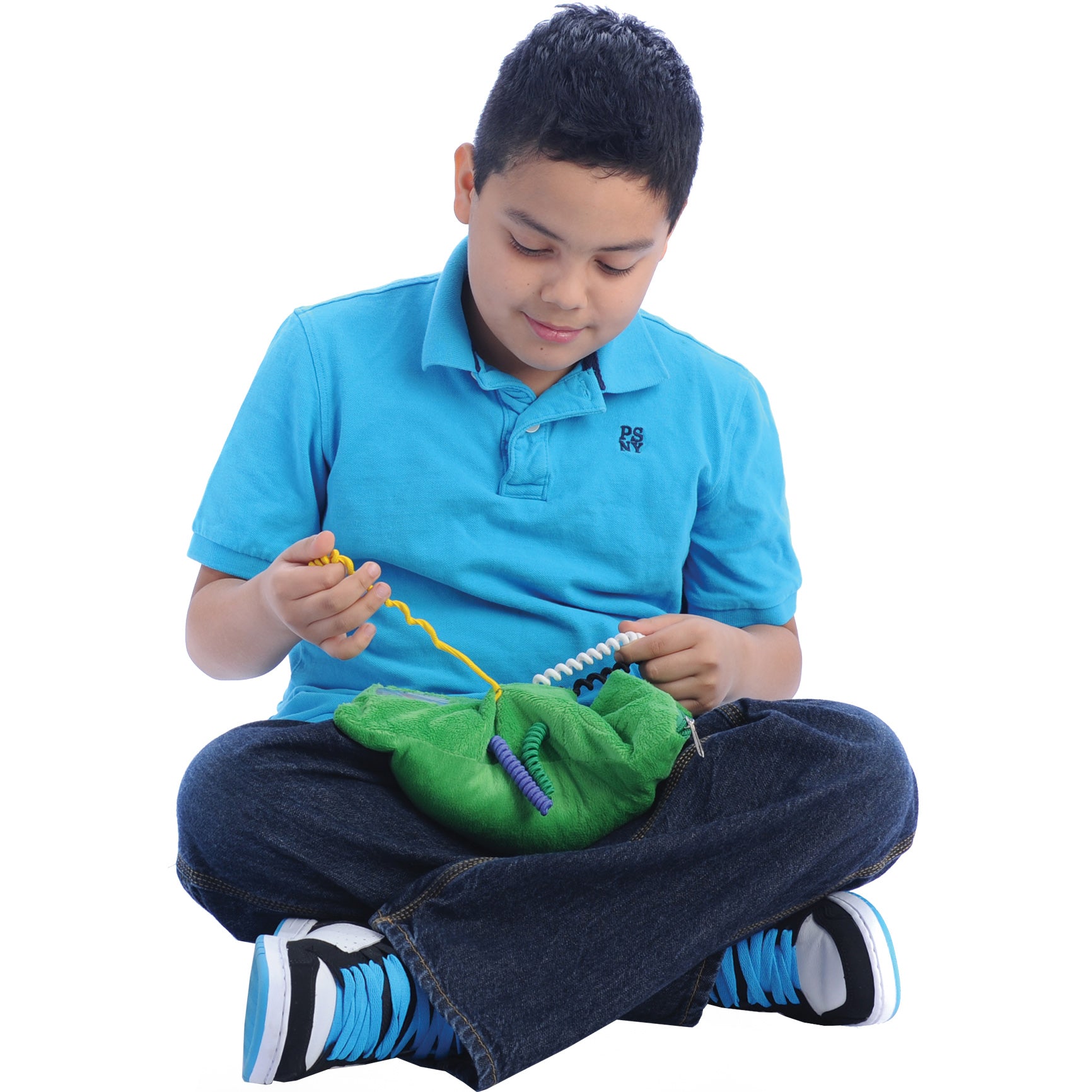 Boy playing with the Busy Fingers™ Fidget Lap Pad