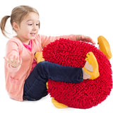 Girl smiling while playing with Harry the Sensory Hedgehog