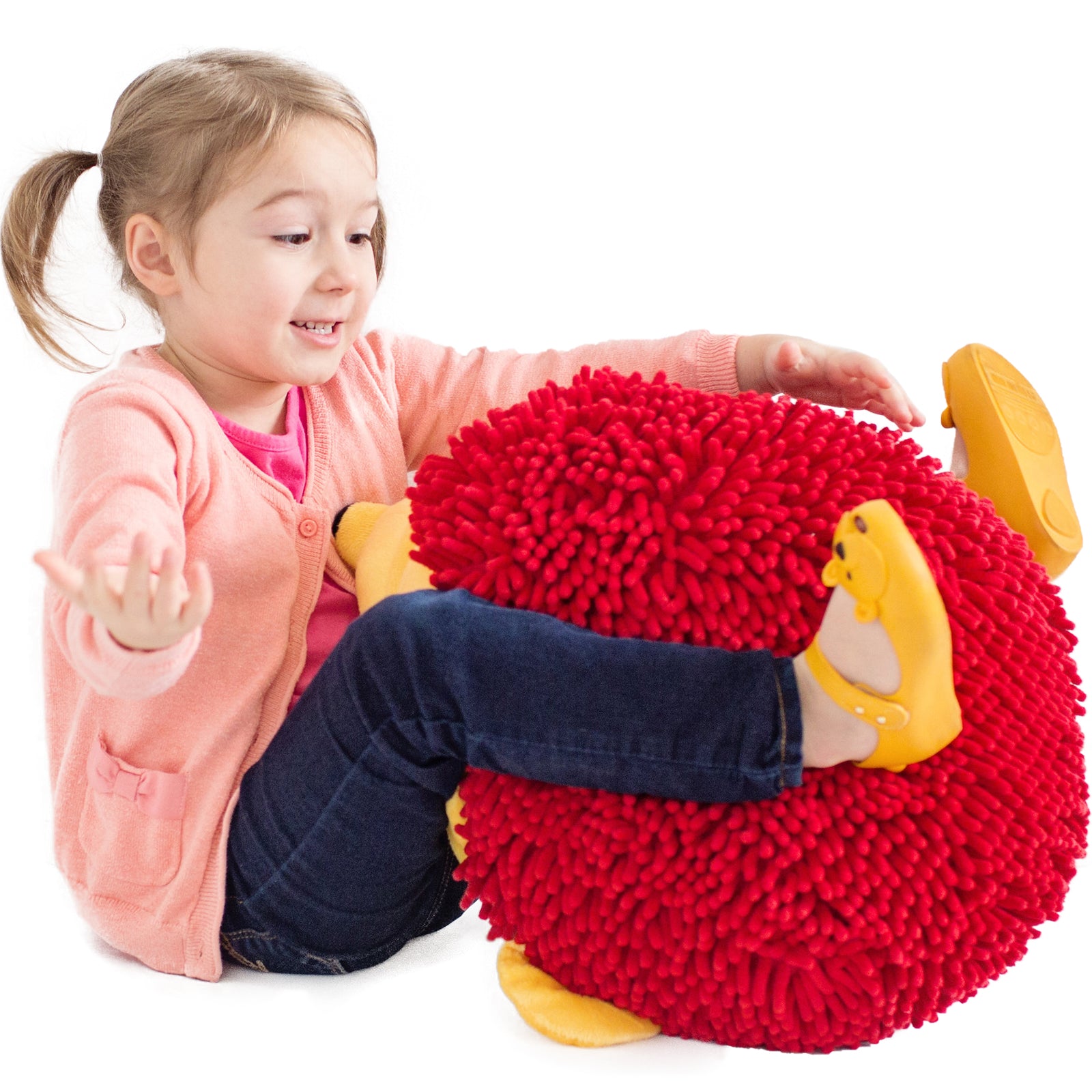 Girl smiling while playing with Harry the Sensory Hedgehog