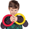 Boy playing with the yellow and red Sensory Twists