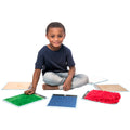 Boy playing with the Sensory Mini Mats