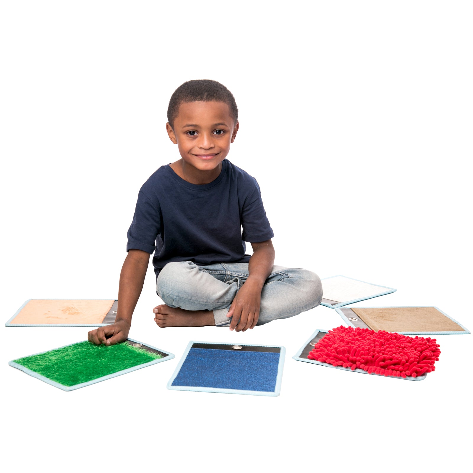 Boy playing with the Sensory Mini Mats
