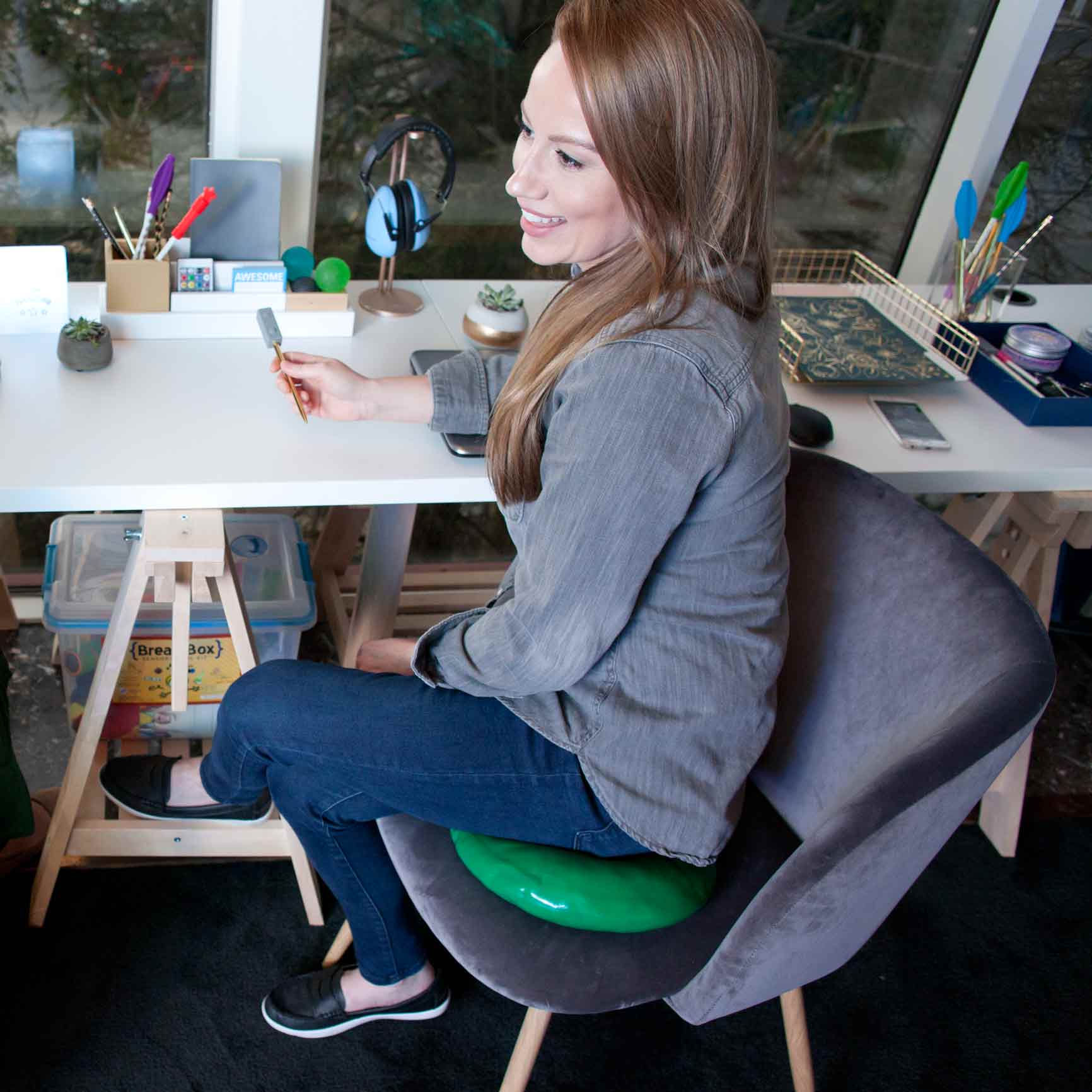 Girl sitting on the green Teen Gel Cushion