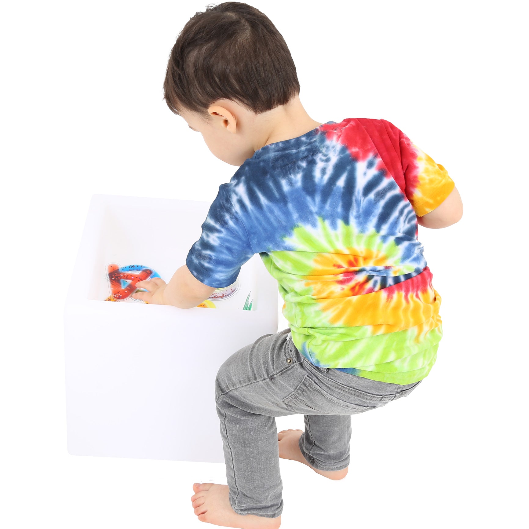 Child playing with the white LimeLite™ LED Sand Table 