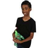 Boy smiling while holding Izzy the Iguana - Weighted Stuffed Animal