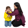 Woman adjusting headphones on a child against a white background