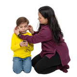 Woman adjusting headphones on a child against a white background