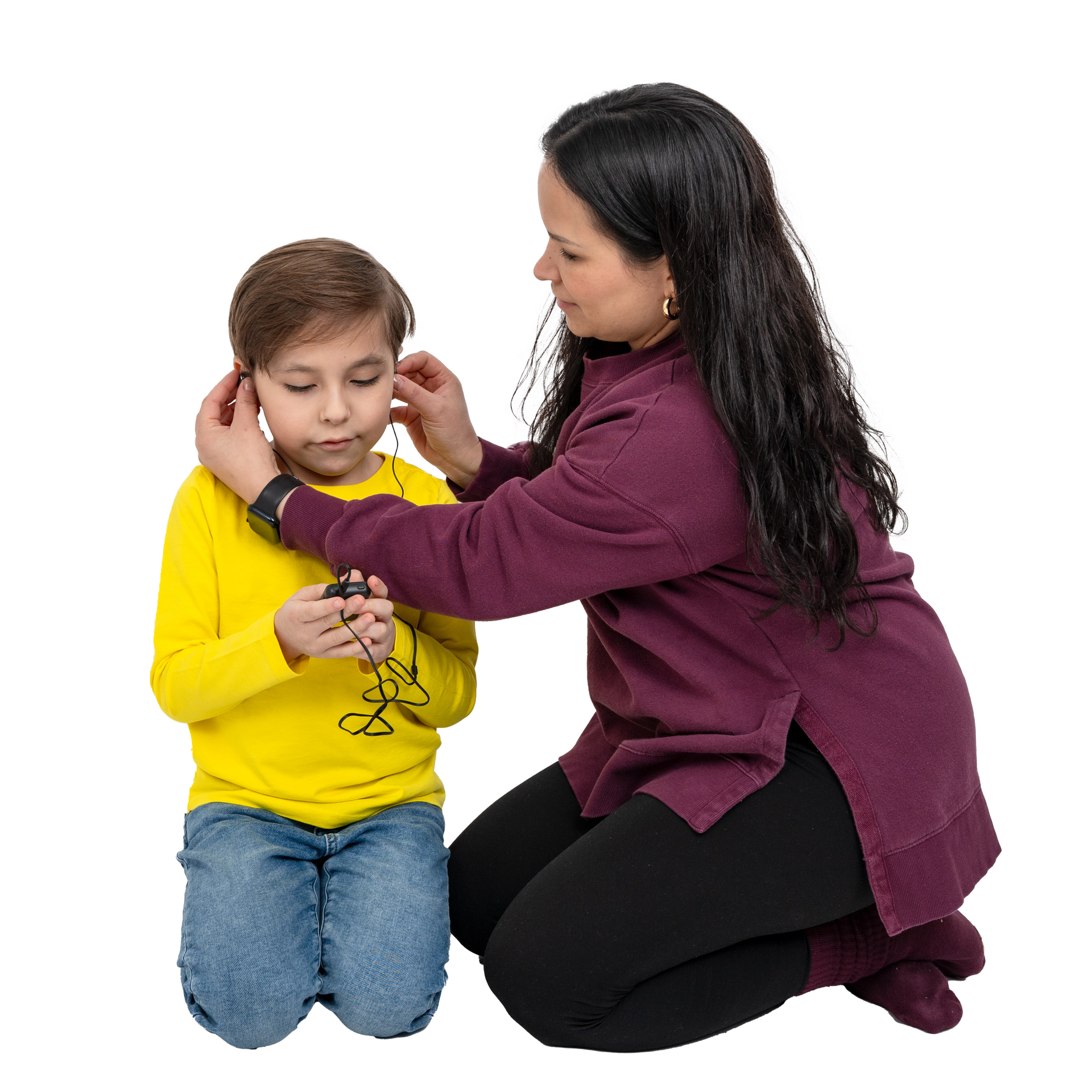 Woman adjusting headphones on a child against a white background