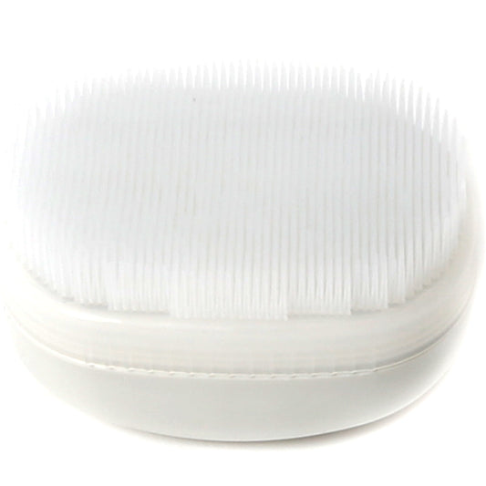 A white Wilbarger Therapy Brush