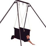 boy laying front-down in the blue Soft Taco Swing suspended from a swing stand