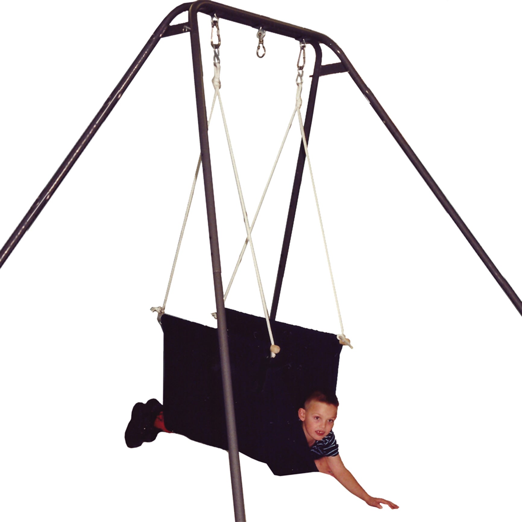 boy laying front-down in the blue Soft Taco Swing suspended from a swing stand
