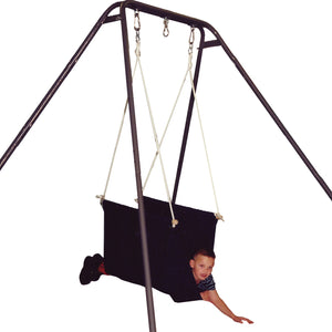 boy laying front-down in the blue Soft Taco Swing suspended from a swing stand