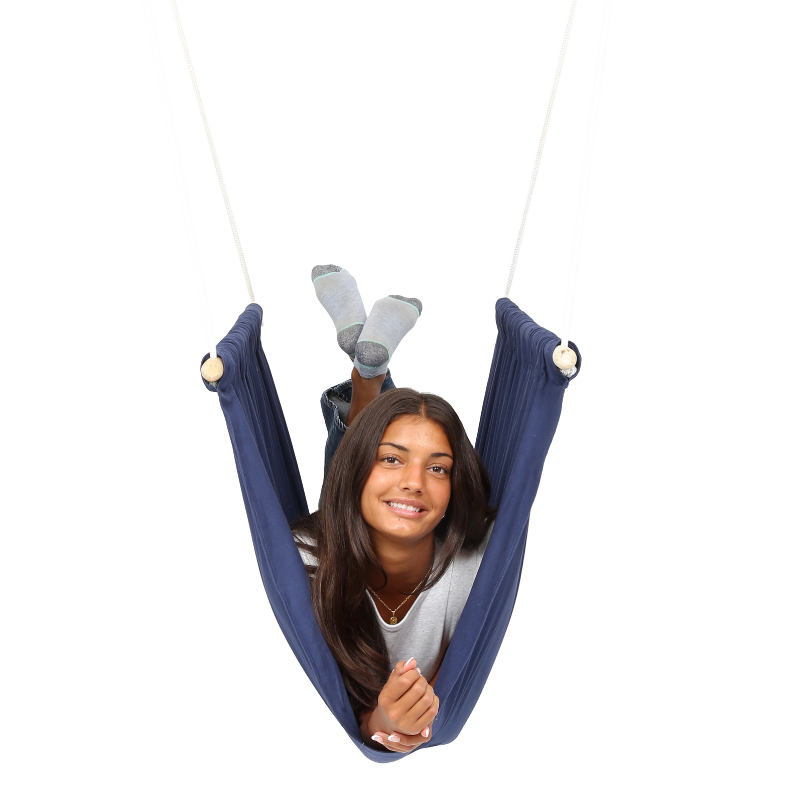 girl laying on her front with feet up inside the blue Soft Taco Swing