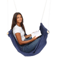 girl sitting and reading in the blue Soft Taco Swing