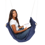 girl sitting and reading in the blue Soft Taco Swing