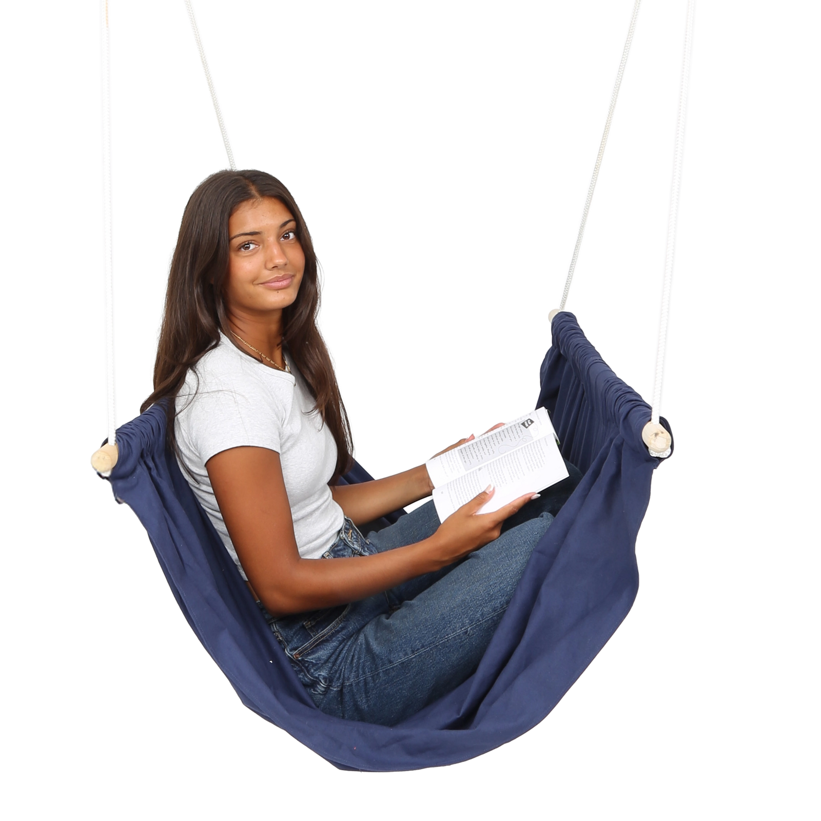 girl sitting and reading in the blue Soft Taco Swing