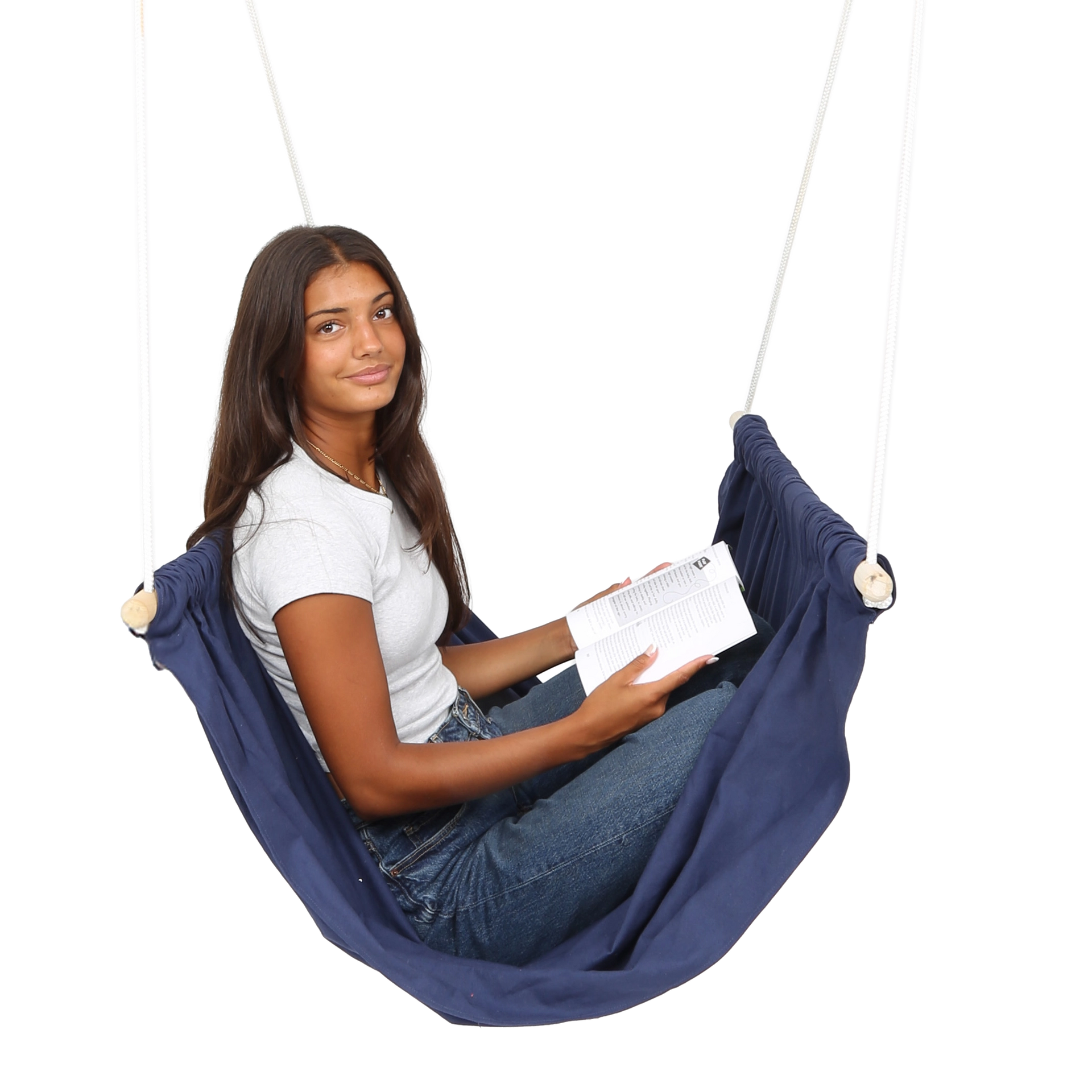 girl sitting and reading in the blue Soft Taco Swing