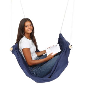 girl sitting and reading in the blue Soft Taco Swing