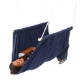 girl lying on her back in the blue Soft Taco Swing