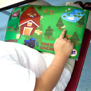 Child using the Find Me™ Lap Pads