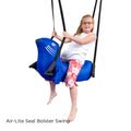 child on the Seal Bolster Swing