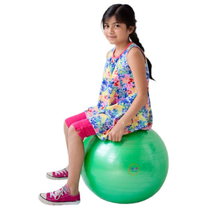 Girl sitting on the green therapy ball
