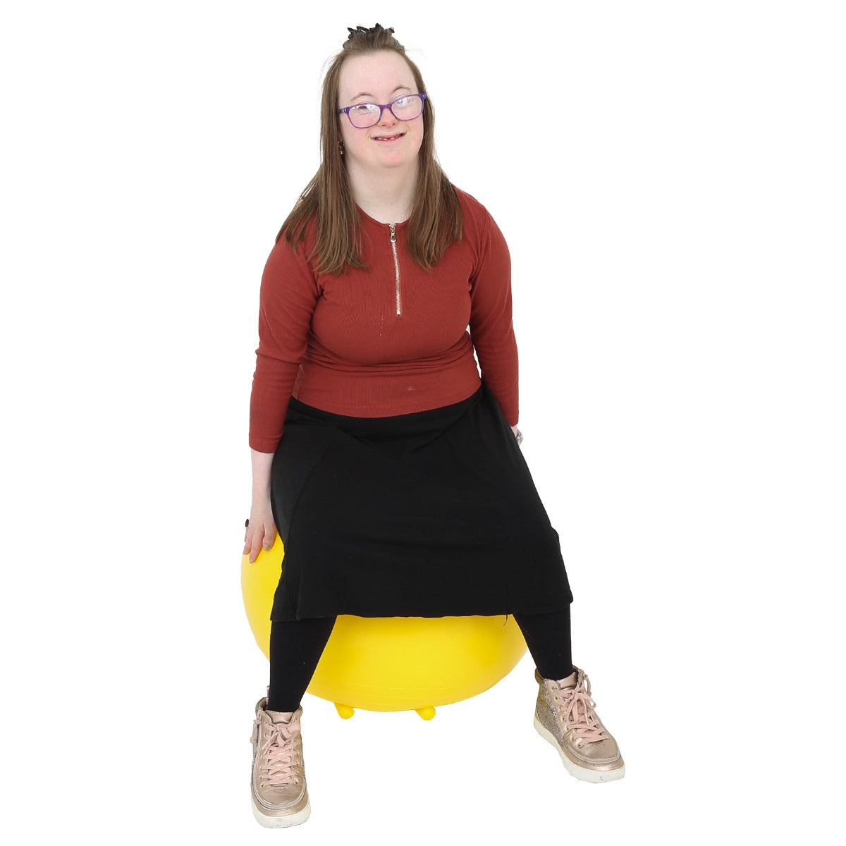 Girl using the yellow Chair Ball