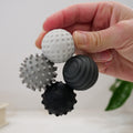 hand holding up the ONO Signets magnetic fidget balls