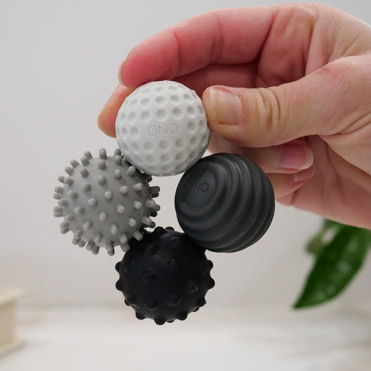 hand holding up the ONO Signets magnetic fidget balls