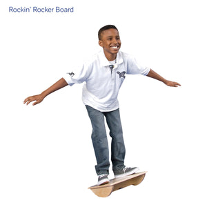 Boy smiling while using the Rockin' Rocker Board