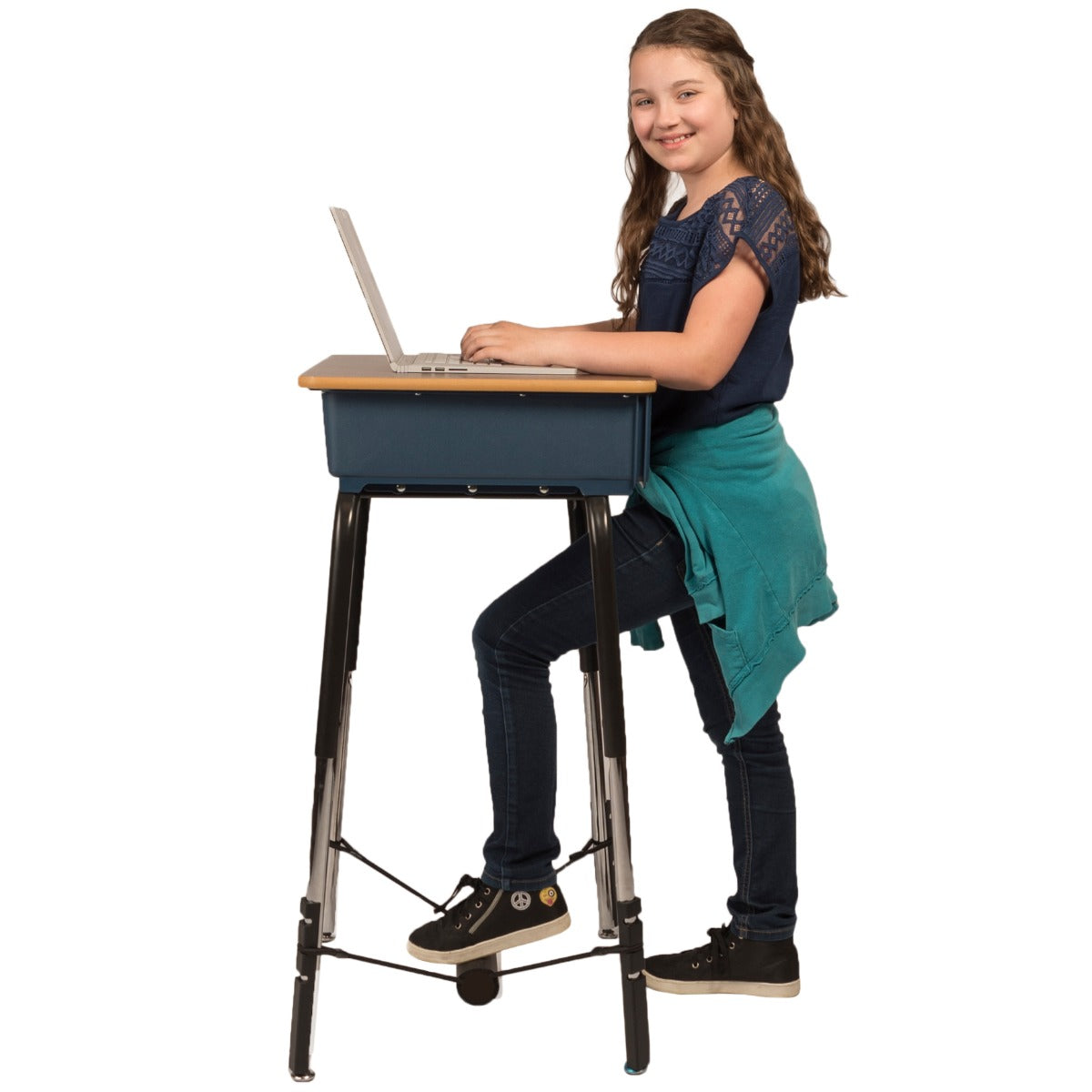 Girl working at a desk using The Original FootFidget  Footrest