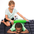 Girl using the Textured Foam Roller on a child's back