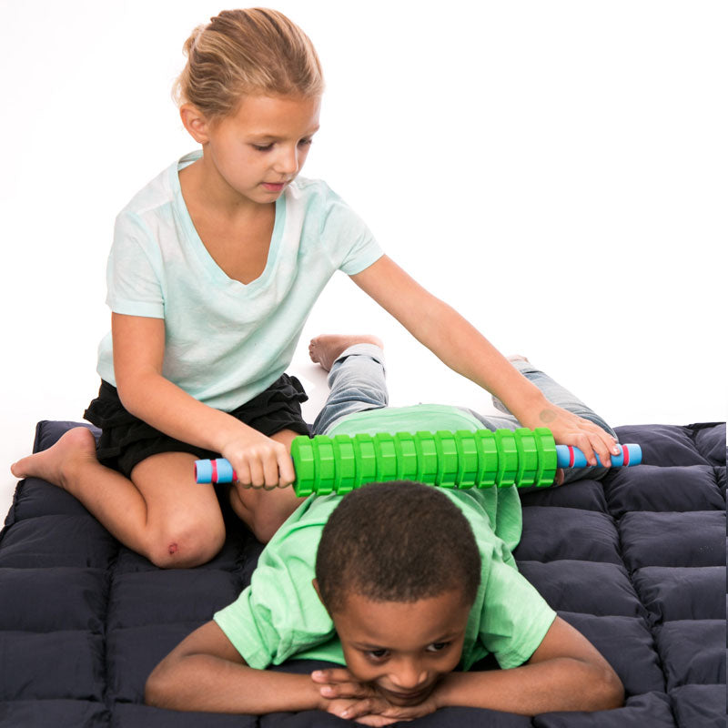 Girl using the Textured Foam Roller on a child's back