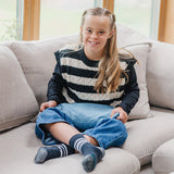 Girl using the Denim Weighted Lap Pad