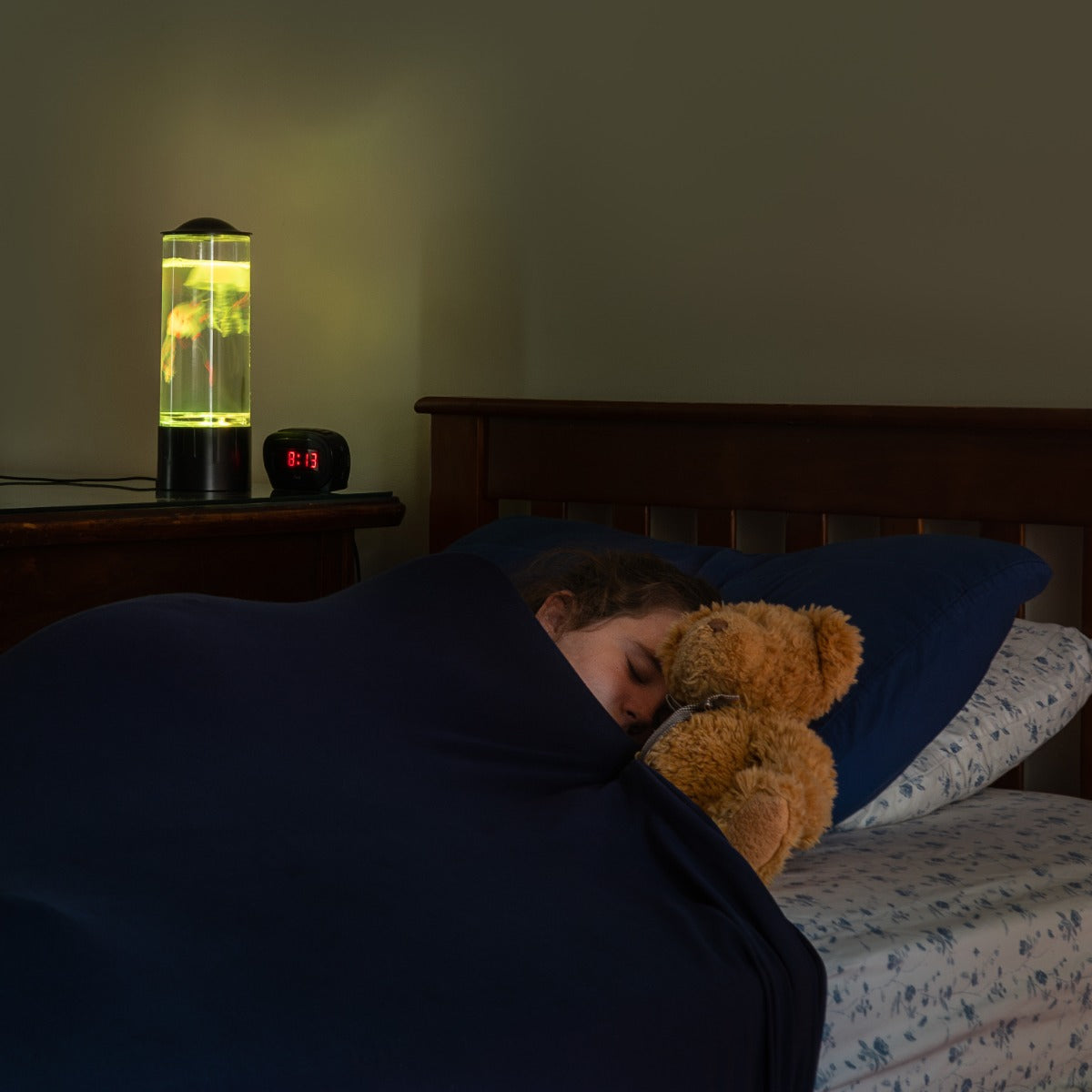 Girl sleeping while using the Snuggle Compression Sheet