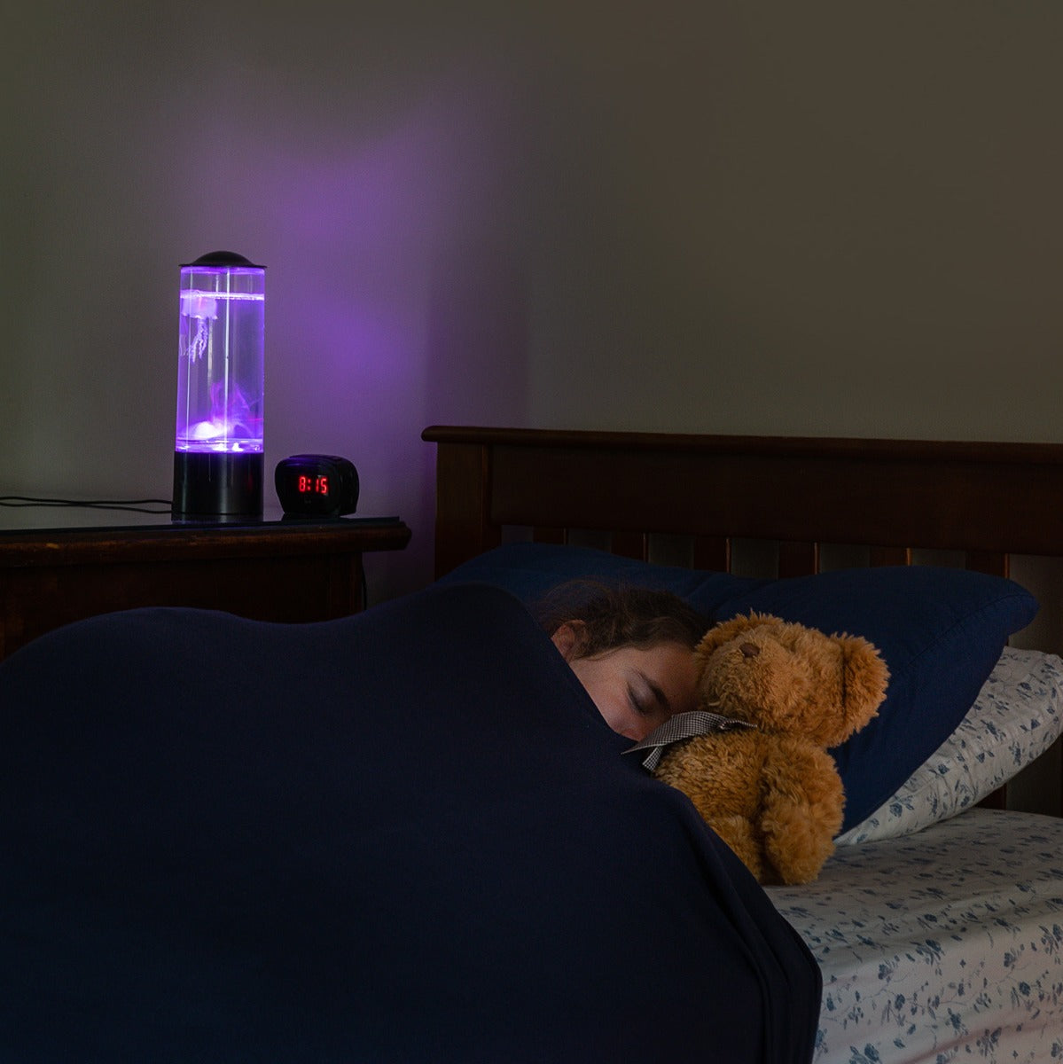 Girl sleeping while using the Snuggle Compression Sheet