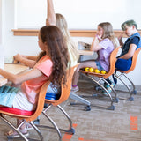 Child using the Boundary Wiggle Seat in a classroom